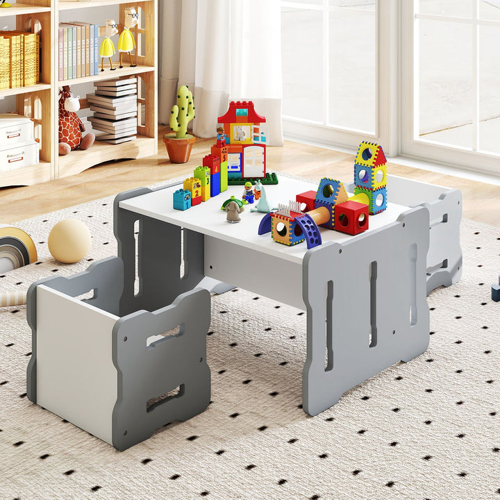 Grey and white convertible kids furniture arranged as an activity table with two chairs