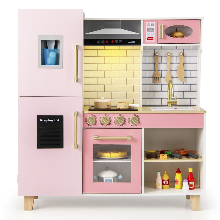 Pink wooden play kitchen with fridge, pretend ice maker, range hood, microwave, oven and sink