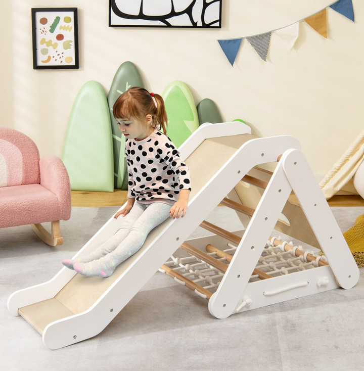 White three-sided wooden climber with slide, rung ladder and rope net