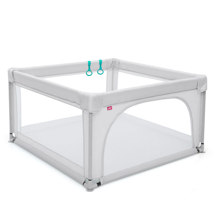 Grey square mesh playpen with two pull rings visible