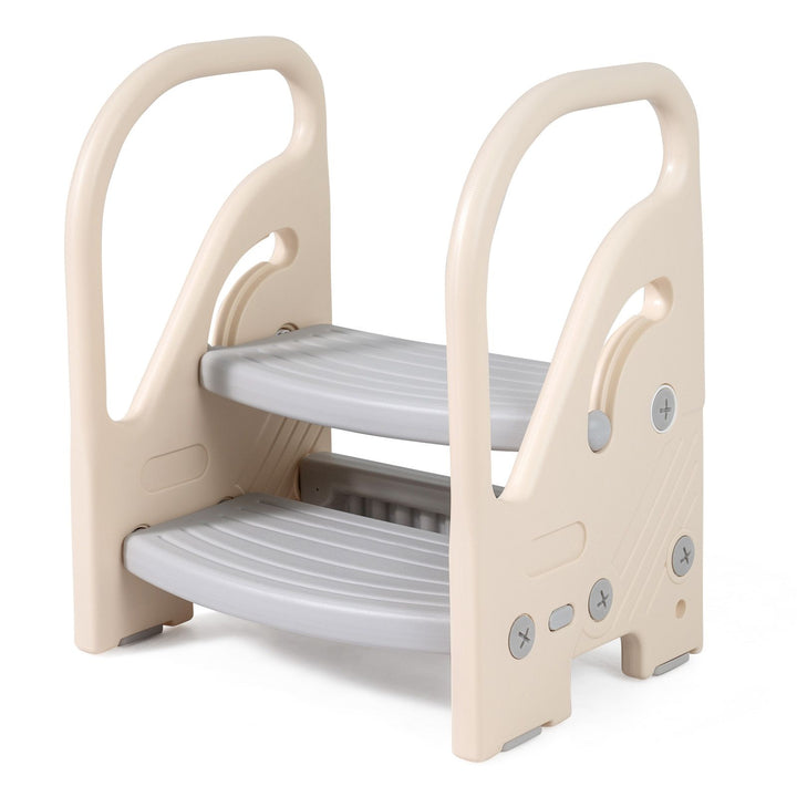 Beige and grey toddler step stool with two grooved steps and curved side handles, viewed from the front right