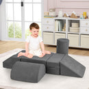 Grey chenille foam play pieces arranged at floor level