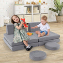 Grey modular velvet play couch in a playroom