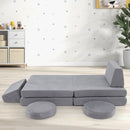 Grey modular play couch arranged as a long seat