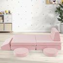 Pink modular play couch arranged as a long seat