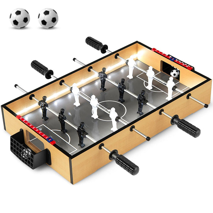 Natural tabletop foosball game with LED light strips and black and white players