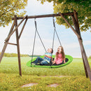 Green oval swing on an outdoor support frame