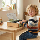 18-Key Wooden Kids Piano with Music Stand: green keyboard on a table