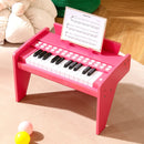 Pink 25-key mini toy piano with light-up teaching keys, view 1