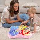 Parent supervising pink floor-play tray