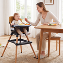 Black wooden high chair during supervised mealtime