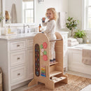 Adjustable Kids Activity Tower with Chalkboard Slide – tower positioned at a bathroom basin