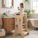 Adjustable Wooden Activity Tower with Chalkboard and Games – tower positioned by a bathroom basin