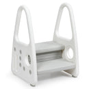Grey two-step stool showing the grooved treads, tall side handles and round side fasteners