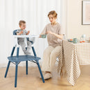 Blue convertible high chair, family mealtime setting