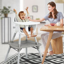 Grey convertible high chair, family mealtime setting