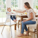 White convertible high chair, family mealtime setting