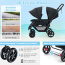 Black tandem double stroller, front swivel-wheel locks and rear foot brakes