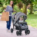Grey tandem double stroller, outdoor use of the front and rear seats