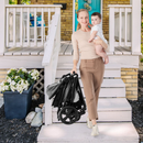 Black reversible stroller, folded stroller being carried