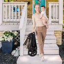 Beige reversible stroller, folded stroller being carried