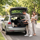Grey folding stroller, folded stroller shown in a car boot