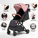 Pink folding stroller, harness, wrist strap, bumper and storage details