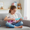 Children’s 53 cm Mini Ukulele with Nylon Strings – child seated with the ukulele