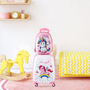 White and pink unicorn luggage set in a styled room; rocking horse and furniture excluded