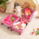 Open pink unicorn suitcase and backpack showing compartments; displayed clothes, books and toys excluded