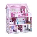 Angled view of the pink wooden dollhouse, balcony and miniature furniture