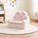 Pink and cream paw-back toddler sofa in seated configuration; surrounding furniture and toys are not included