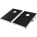 Two black cornhole boards viewed from above at an angle