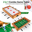 Both sides of the reversible tabletop game, showing foosball and manual puck hockey