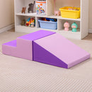 Purple step and ramp foam blocks arranged together on the floor in a playroom