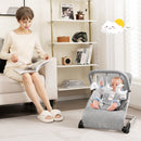 Folding Baby Bouncer with Toy Bar and Washable Cover – grey bouncer in a living room