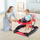 Parent supervising red baby walker