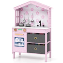 Pink house-shaped wooden play kitchen, angled view