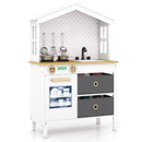 White house-shaped wooden play kitchen, front view