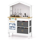 White house-shaped wooden play kitchen, angled view