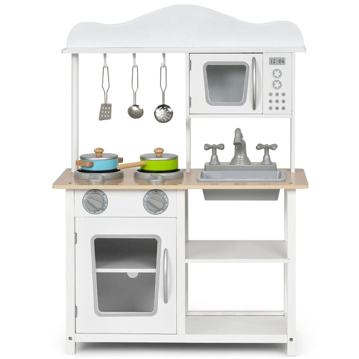 White play kitchen with toy microwave, oven, sink, two hob rings and cookware