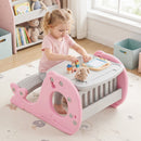 Pink activity table and integrated bench in use; toys are styling props