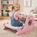 Pink activity table showing its book-storage side