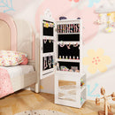 White jewellery cabinet open in a bedroom with example jewellery arranged inside