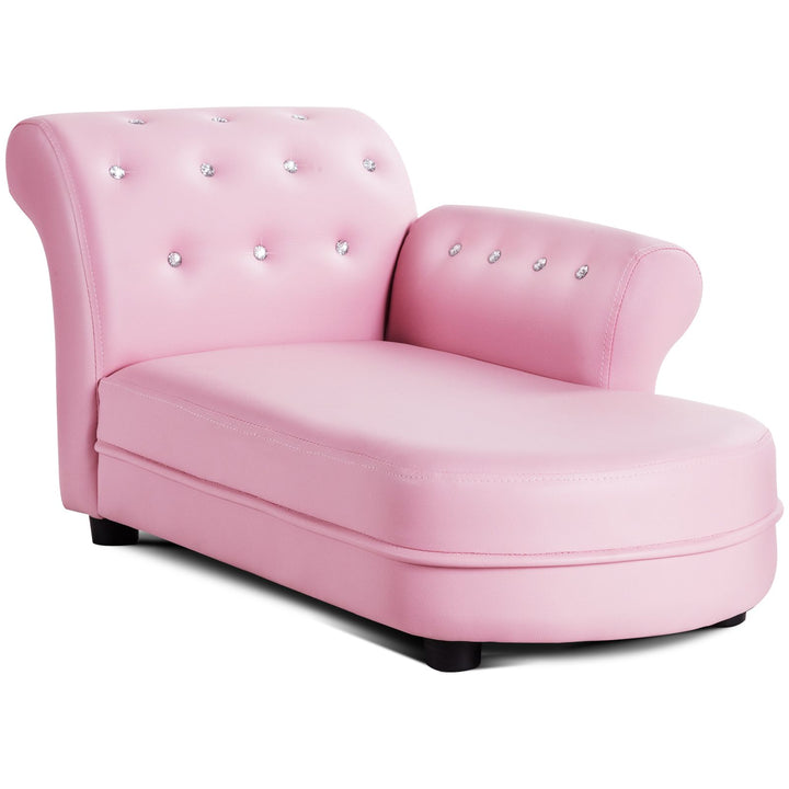 Pink chaise-style kids sofa with curved side arm and decorative crystal-look buttons