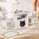 White kids table and two chairs with under-seat storage bins in a room