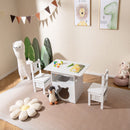 White kids table and chairs with cat-shaped opening and two storage bins