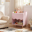 Pink nightstand with open shelf in a reading corner