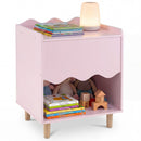 Pink bedside table with scalloped front and natural legs