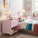 Pink bedside table in a styled bedroom